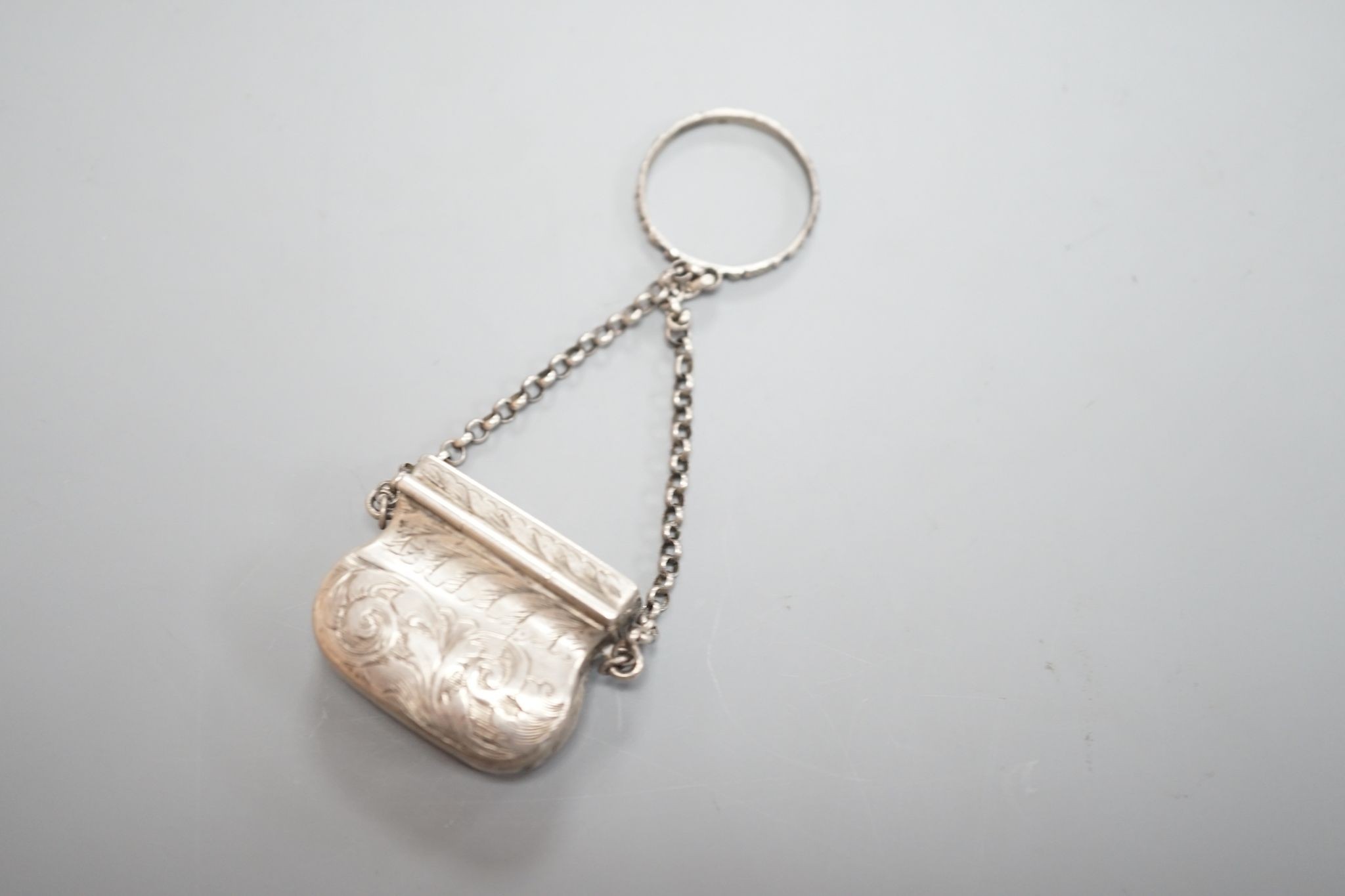 A Victorian novelty silver vinaigrette, modelled as a handbag, John Tongue, Birmingham, circa, 1840 (date letter rubbed), width 27mm.